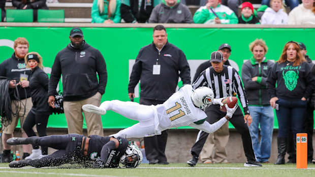 Nov 13, 2021; Huntington, West Virginia, USA; UAB Blazers wide receiver Trea Shropshire (11) attempts to dive for a touchdown while being tackled by Marshall Thundering Herd defensive back Steven Gilmore (3) during the first quarter at Joan C. Edwards Stadium. Mandatory Credit: Ben Queen-USA TODAY Sports